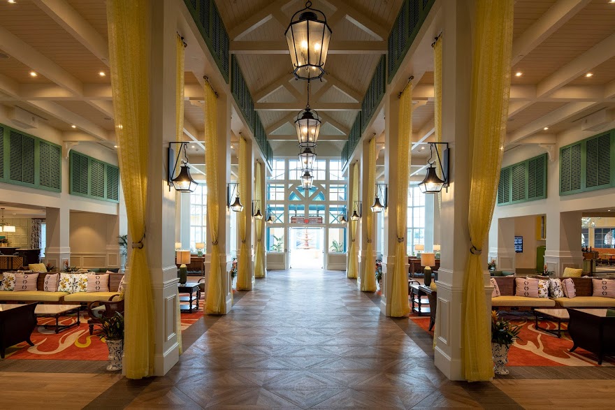 Walt Disney World Hotel for Every Budget featured by top US Disney blogger, Marcie and the Mouse: The Old Port Royale complex has been reimagined as a new port of entry for Disney’s Caribbean Beach Resort. It’s a centralized and convenient location for services, amenities and three new dining options. Guests arrive at Old Port Royale via an all-new porte-cochere, where they are welcomed into a colorfully reappointed lobby under an open-trussed roof and a colonnade with floor-to-ceiling drapes. Friendly cast members are waiting in this open and communal environment to help guests check in to their rooms, answer questions, offer advice to help them better enjoy their stays and more.
